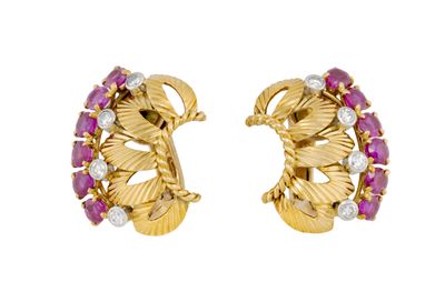 a pair of ruby and diamond earrings