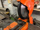 a saw that is sitting on a table in a workshop