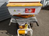 an image of a yellow and white box sitting on top of a cart