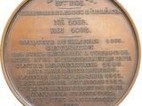 an old bronze medal with the names of the people who fought the civil war