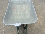 a wheelbarrow that is sitting on the ground