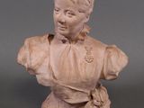 a statue of a woman that is sitting on a table