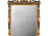 un miroir richement décoré, avec des bordures dorées et noires