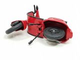 a toy motorcycle that is sitting on a white surface