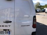 a white van that is parked in a parking lot