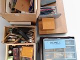 several boxes of assorted items are stacked on top of each other