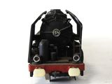 a toy train that is sitting on a white surface