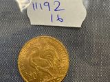 a gold coin in a plastic bag with a label on it