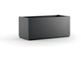 the large black planter is sitting on a white surface