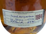 a label on a bottle of whisky on a table