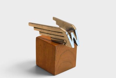 a wooden block with a bunch of keys in it