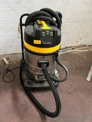 a wet vacuum that is sitting on the floor
