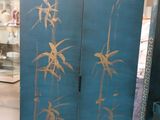 a room divider that has a bamboo design on it