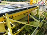 a solar panel on the back of a yellow tractor