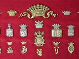 many different types of badges displayed on a red surface