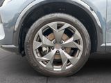a close up of a car ' s wheel on the street