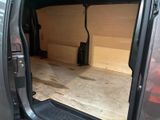 the back of a van with the door open showing the inside of the van