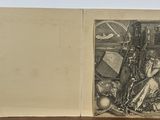 un vieux livre dans lequel figure le dessin d'un homme et d'une femme