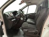 the interior of a car with the door open and the driver ' s seat down
