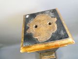 a small wooden table with a hole in the middle of it