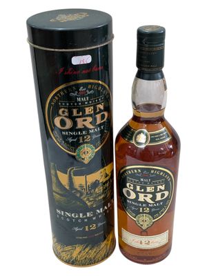 a bottle of glen ord single malt whisky next to a black box