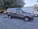 a picture of a grey van parked in a parking lot