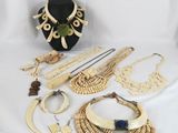 an assortment of jewelry including a necklace, bracelet, and other items