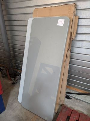 an image of a refrigerator outside in a garage