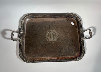 an antique silver tray with handles and handles on a white surface