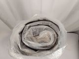 a white toilet with a roll of toilet paper in it