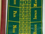 a green and yellow score board with numbers on it
