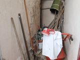 a red fire hydrant in the corner of a room next to a wall