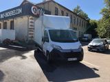 a white van parked in front of a building