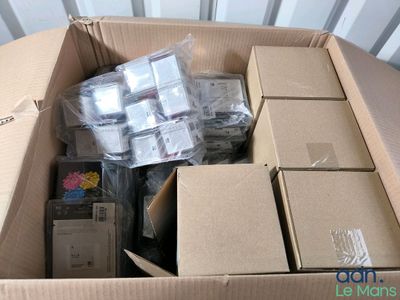 a cardboard box filled with electronic equipment and other items