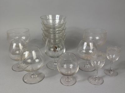 a lot of wine glasses that are sitting on a table