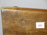 a close up of a piece of wood with a sticker on it
