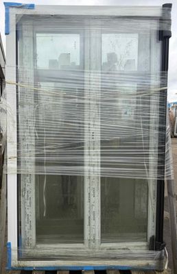 a large window that has been wrapped up and ready to be installed