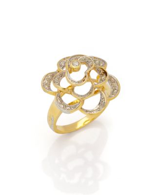 a gold and diamond ring with a flower design