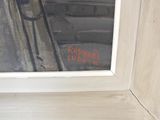 a painting on the window sill of a building
