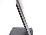 a cell phone that is sitting on top of a stand