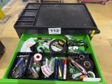 a green tool box filled with assorted office supplies