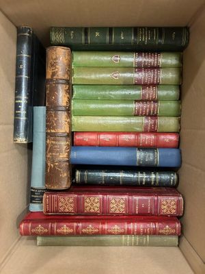 a box full of old books sitting on a table