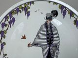 a plate with a picture of a woman on it