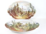 deux assiettes ornées d'une peinture représentant une scène de forêt