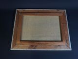an image of a picture frame on a table with a black background