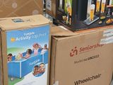 boxes stacked on top of each other on a cart in a store