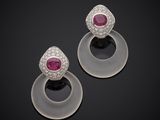 a pair of ruby and diamond earrings