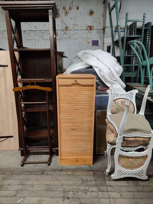a lot of furniture in a room with a chair and a cabinet