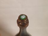 a bottle of wine that is sitting on a table