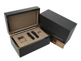 the watch box is open and has a watch inside of it